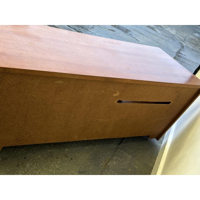 A compact mid-century teak media cabinet / tv stand produced by scottish mid-century manufacturer ‘sakol’. Featuring a...