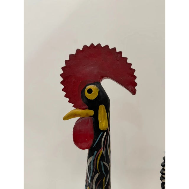 Vibrant hand-painted ceramic rooster from Portugal, richly detailed in traditional Barcelos folk motifs with heart and...