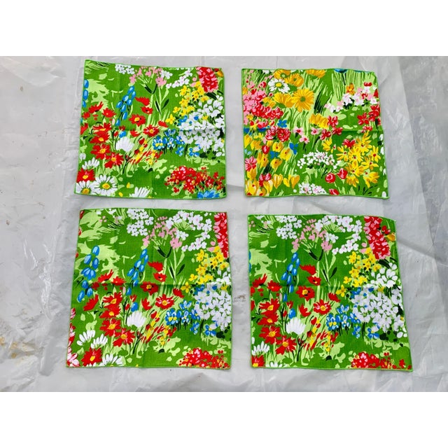 Stunning set of 4 vintage napkins. Multicolored floral design. Cheerful and colorful. Guaranteed to add a pop to any table...