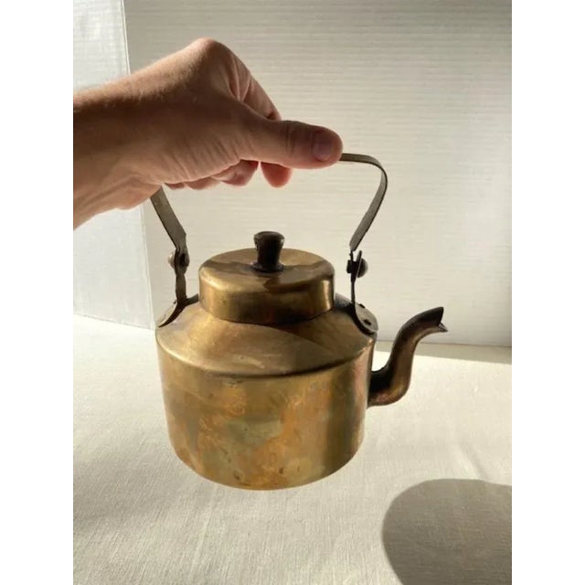 These brass kettles were used in India by the English when traveling during the days of the Raj. Hammered Brass with hand...