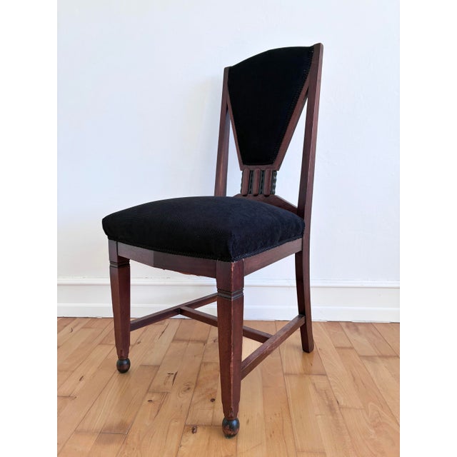 A set of four Dutch Art Deco dining chairs, dating to the 1930s. The chairs have strong geometric lines, a high...