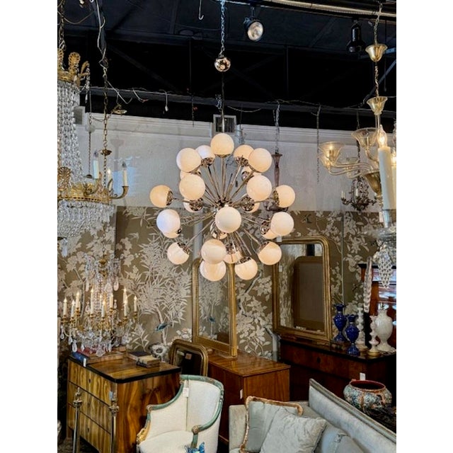 Large and impressive modern Murano glass and brass sputnik chandelier. Circa 2000. The chandelier has been professionally...