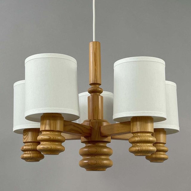 Swedish Design Pine Chandelier, 1970s, Scandinavian Modern The light features a sculptural wooden chandelier crafted from...