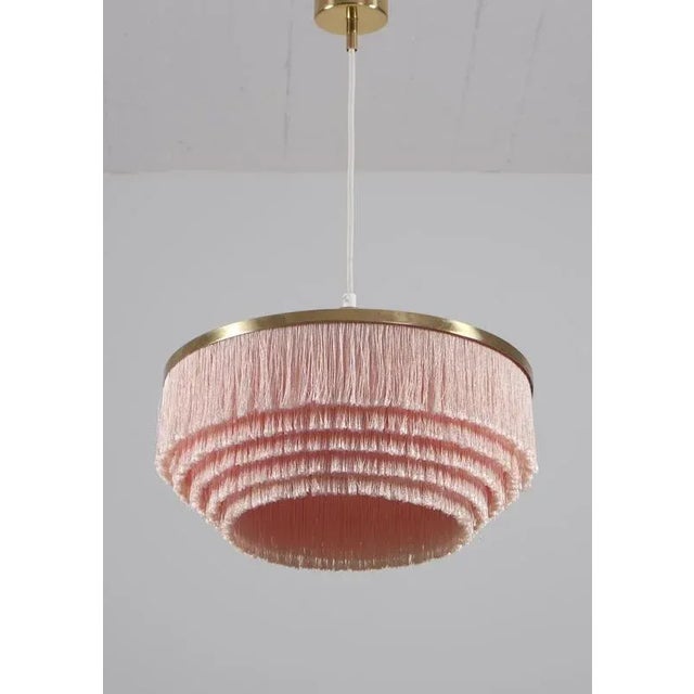 Hans-agne jakobsson t603 pendant with pink fringes, 1970s. Produced in sweden by hans-agne jakobsson ab in markaryd,...