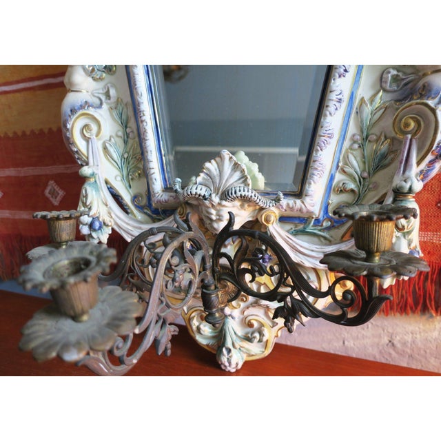 Hugo Lonitz majolica wall mirror with bevelled glass and triple candelabra. Dates from 1890-1900. Double fish impressed...