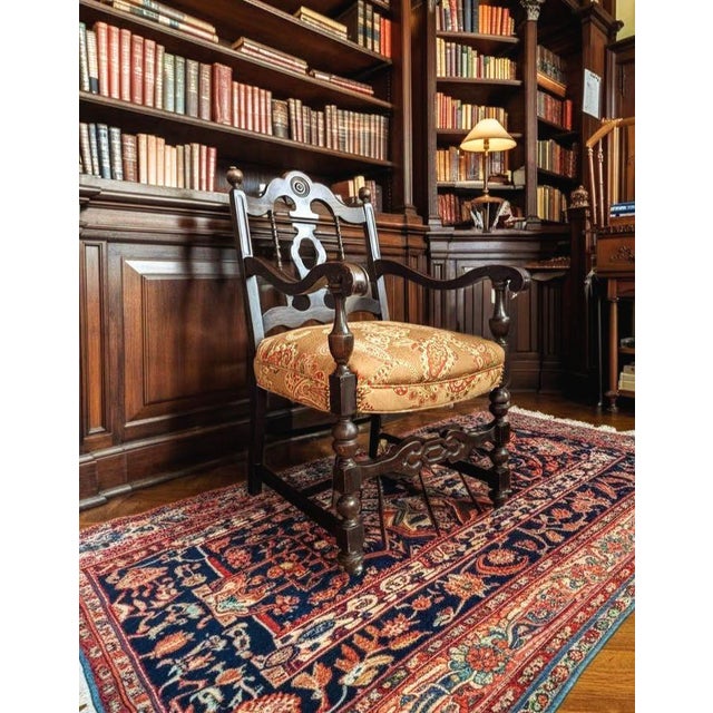 Elevate your home decor with this stunning, early 20th-century armchair, crafted in the distinguished Chippendale taste....