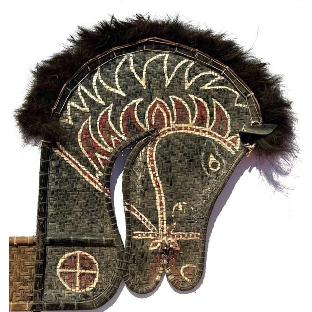 This is a unique ceremonial piece of puppetry art from the island of Java in Indonesia. It is called a Kuda Lumping Horse...