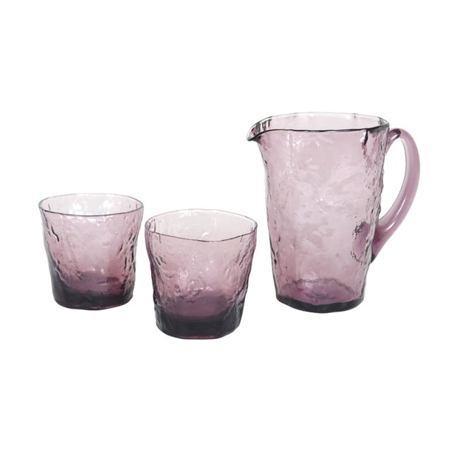 A three piece glassware set made by Morgantown of West Virginia. The set consists of a Tijuana pitcher and two Double Old...