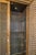 1960s Gold Leaf Finish Wood Cabinet With Carved Lattice Doors and Glass Shelving For Sale In New York - Image 6 of 7