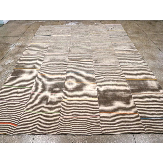 A modern rustic Turkish flatweave Kilim room size carpet handmade during the 21st century. Measures: 10' 6" x 14' 9".