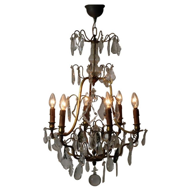 Let yourself be enchanted by this antique crystal chandelier. Very rare to find in this early antique form. This...