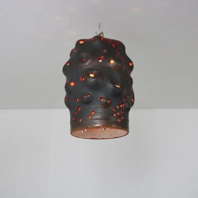 A wonderful free form hanging lamp with a unique style, signed “l.h.”, made in the netherlands around 1960. made of high...