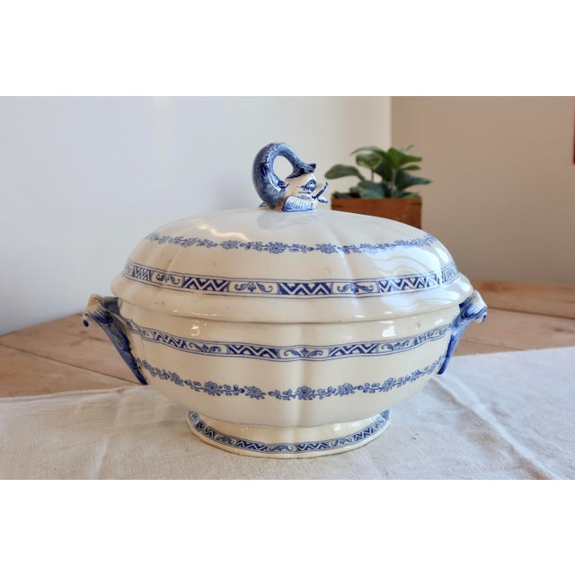 Large antique Gien earthenware tureen decorated in the Royal pattern, recognizable by its elegant blue friezes and lid...