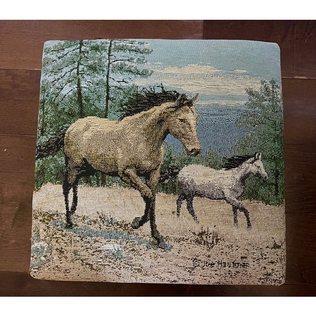A beautifully detailed vintage tapestry footstool featuring an elegant countryside scene with two horses moving gracefully...