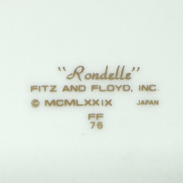 Black & gold side plates, group of 8. This is a gorgeous set of Fitz & Floyd "Rondelle" side plates featuring a black and...