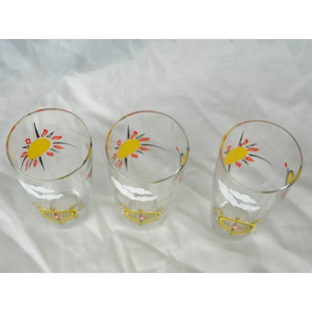 Set of 3 water glasses with screen-printed wind rose, world map and rudder These retro glasses give a travel vibe to any...