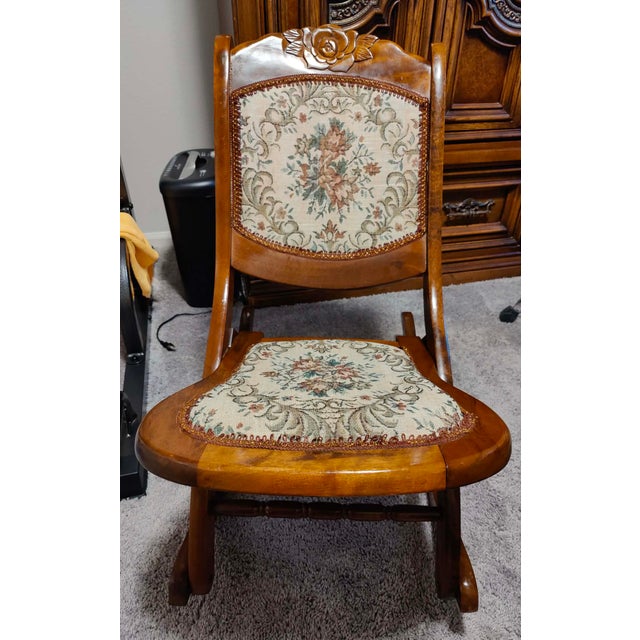 Add a touch of timeless charm to your home with this gorgeous, vintage Victorian-style folding rocking chair. Historically...