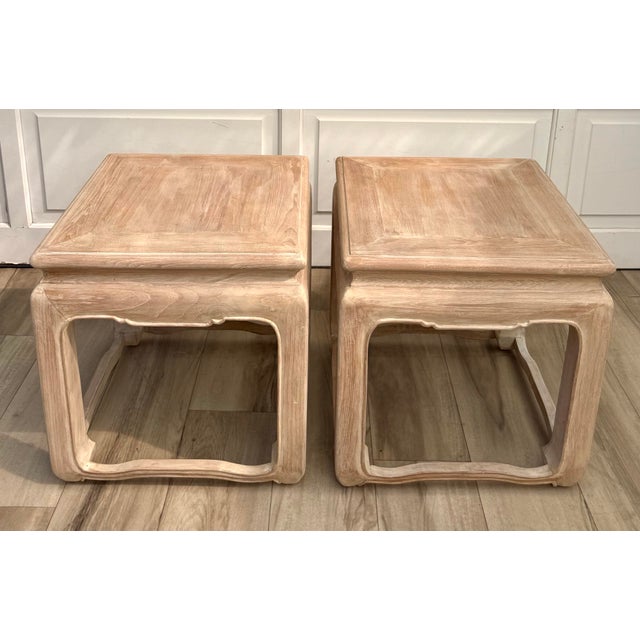 A beautiful pair of vintage Ming-style side tables featuring sculptural, curved legs, subtly shaped aprons, and a softly...
