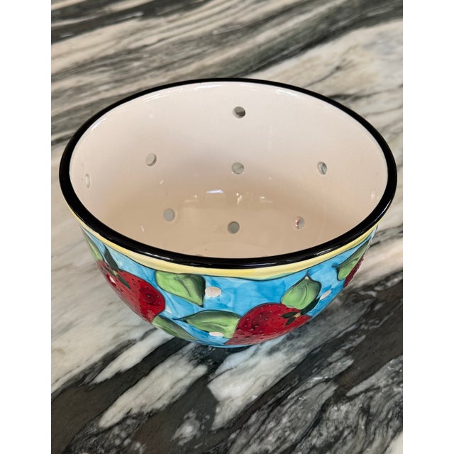 From the imagination of Denise Ford for Ganz, we present this hand painted berry strainer bowl in strawberry motif. A...