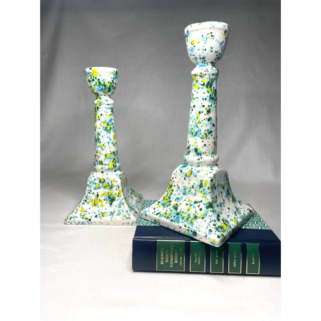 A mix of modern and traditional styles are reflected in this pair of candlesticks. The speckled paint colors of...