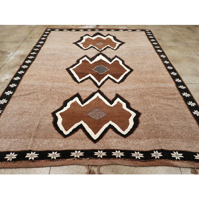 A vintage Turkish Anatolian tribal room size carpet handmade during the mid-20th century. Measures: 10' 8" x 14' 2"