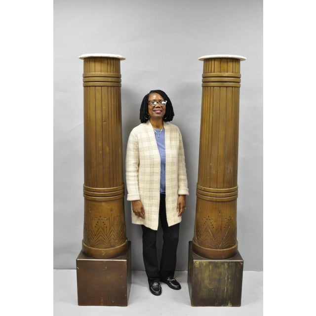 Antique Art Deco 75" Tall Wooden Fluted Columns with Geometric Chevron Skyscraper Carved Motif - a Pair. These stunning...