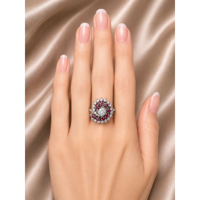 Elegant 14K white gold floral spiral ring featuring 22 brilliant round diamonds totaling 0.7 carats and 8 natural round...