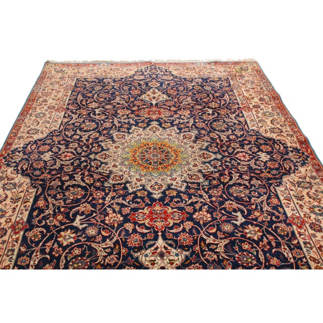 Originating from Persia in 1940, this vintage traditional Isfahan rug employs one of the most finely woven variations of...