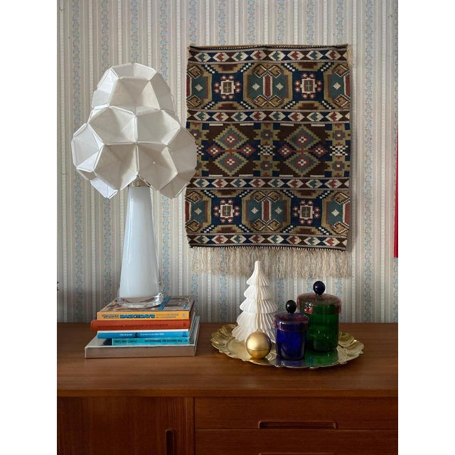 This exquisite Rölakan tapestry hails from the Skåne region of Sweden, dating back to the 1800s. It features stylized...