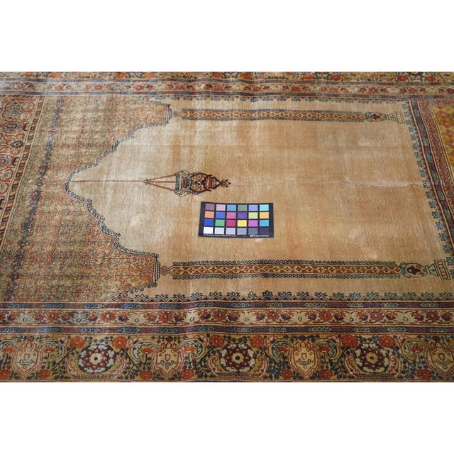 A finely woven city silk in the Turkish style with an ecru field with a scalloped top suspending a mosque lamp and flanked...