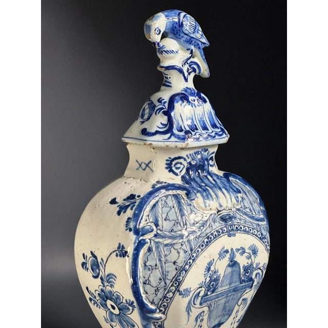The tinglazed faiance blue and white baluster jar with octagonal waisted body painted in shades of blue with a standing...