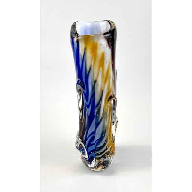 The Gaia Tall Multi Colori Murano glass vase is a stunning example of Murano sculptured glass art. The vase is handcrafted...