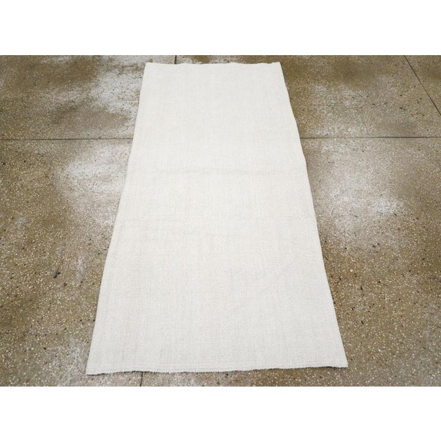 A vintage Turkish flatweave Kilim throw rug handmade during the mid-20th century. Measures: 2' 8" x 5' 9"