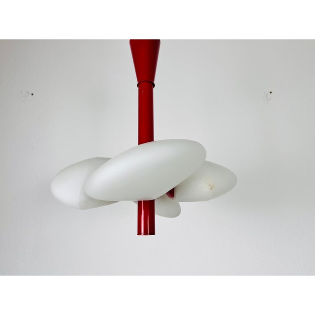 A mid-century chandelier by Kaiser Leuchten made in Germany in the 1960s. It is fascinating with its Space Age design and...
