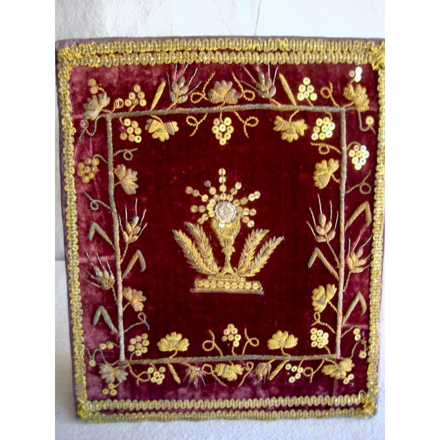This Chalice cover is from the mid 18 hundreds and present a splendid embroidery in gold metallic threads , showing a...