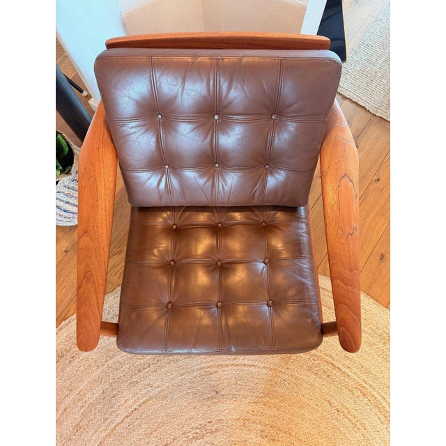 Elegant Danish lounge chair, model FD 164, designed by Arne Vodder in the 1960s. The chair combines the warm appeal of...