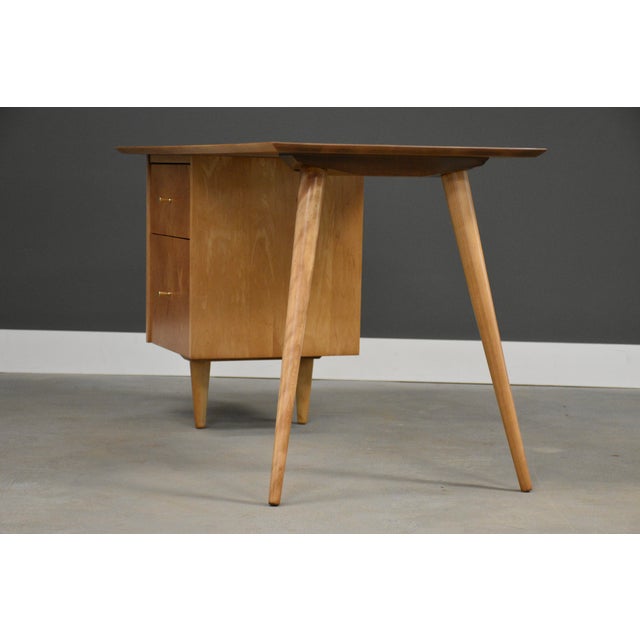 A mid century modern solid maple desk designed by Paul McCobb for Winchendon’s Planner Group. Professionally refinished....