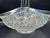 A striking, large‑scale iridescent pressed‑glass centerpiece basket featuring deep diamond‑point faceting, a starburst...