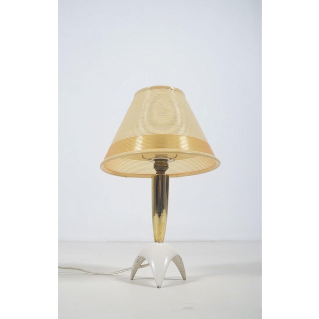 Vintage table lamp by rotaflex from the 1950s. This lamp has a tripod base in metal with a neck in brass. rotaflex was...
