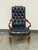 Design Plus Gallery presents a Vintage Traditional Queen Anne Style Tufted Blue Leather Armchair. The chair has a tall...