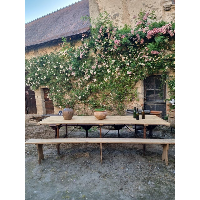 Large antique French folding garden table set with two long benches, dating from approximately 1900–1920. Originally...