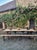 Large antique French folding garden table set with two long benches, dating from approximately 1900–1920. Originally...