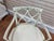 A charming pair of neoclassical armchairs in the Directoire / late Sheraton taste. Each chair features a cream-painted...