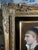 A finely hand-painted antique porcelain portrait plaque depicting an elegant young woman in profile, dressed in...