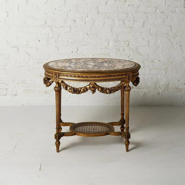 This exquisite 19th-century Belgian accent table showcases the elegance of European antique furniture with its beautifully...