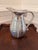 Add classic charm to your bar cart or dining table with this vintage Wilton Armetale “Flutes & Pearls” pitcher. Crafted in...
