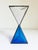 A wonderful brutalist-style hourglass, handmade circa 1970s. Features two triangular-shaped pyramids with a mix of clear...