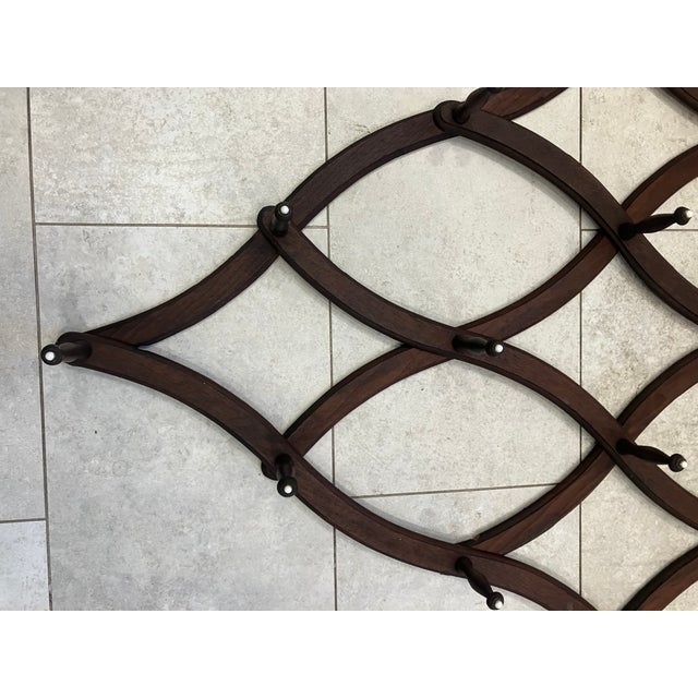 This 19th century expandable hat rack is made of walnut. The design is inspired by Gothic tracery popular during the...