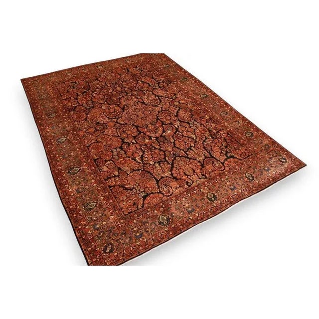 Antique Middle Eastern Sarouk rug | Knot density: High | Pattern: Colorful leaf and floral motifs | Size: 421×306 cm |...
