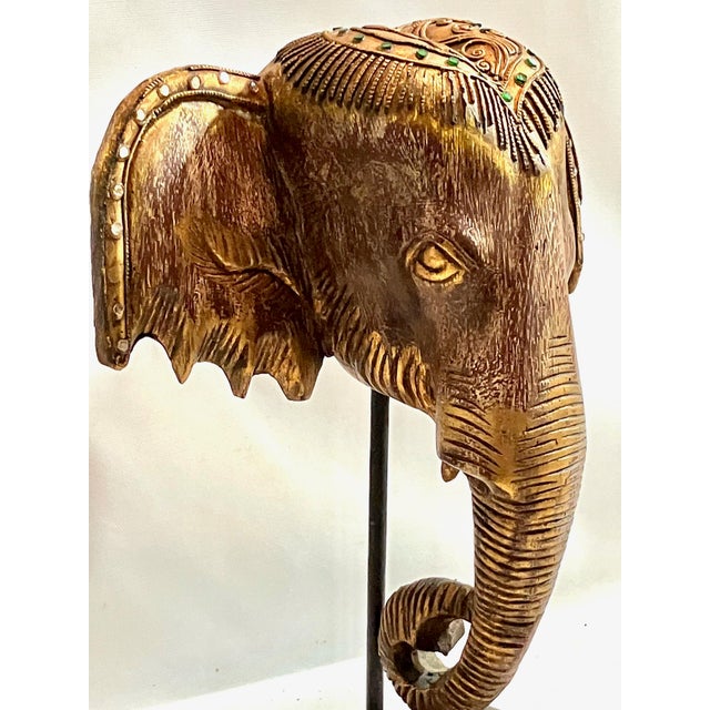 Our lavish elephant is wearing an intricate jeweled head covering, featuring silver and emerald green rhinestones. The...